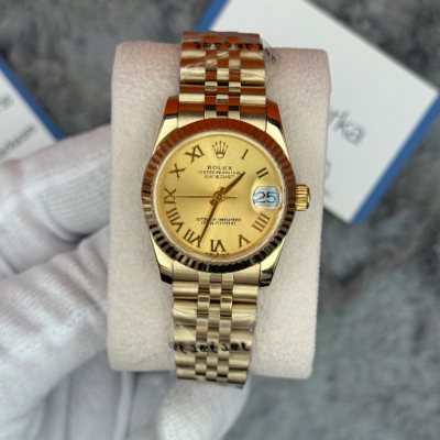 Rolex Datejust with a gold dial, Roman numerals, and a Jubilee bracelet
