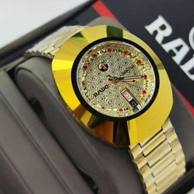 Rado Diastar bright gold-toned case and a patterned dial with red markers
