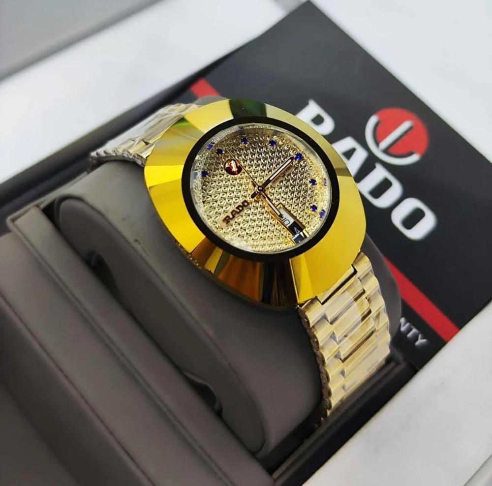 Rado DiaStar polished gold-tone case and a textured gold dial with blue hour markers