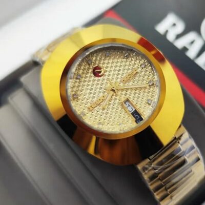 Rado DiaStar diamond-textured gold dial with diamond hour markers, and a day-date display.