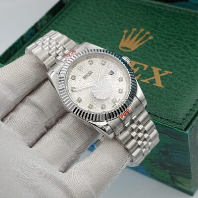 Rolex Datejust silver dial with an engraved pattern and diamond hour markers
