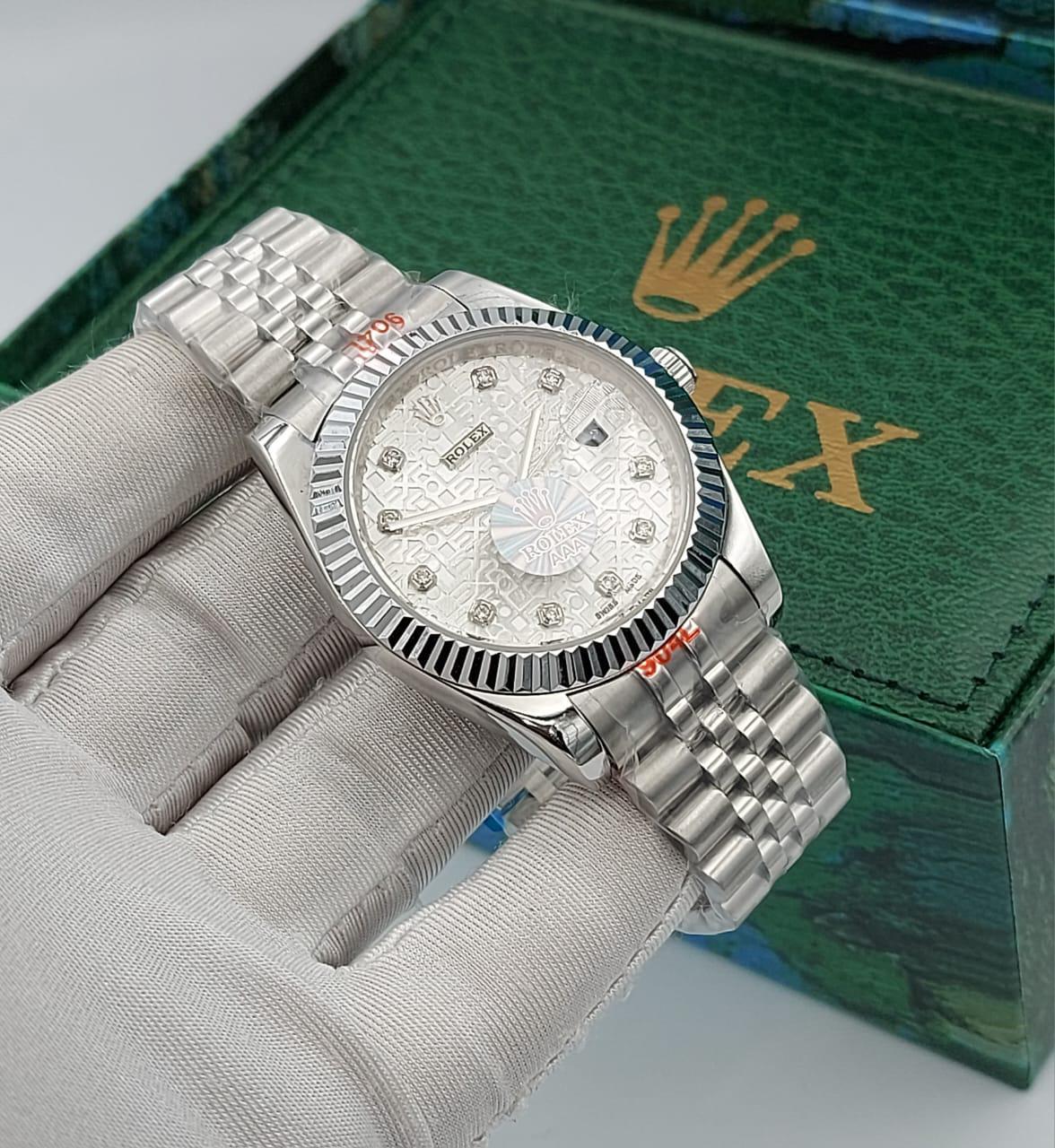 Rolex Datejust silver dial with an engraved pattern and diamond hour markers
