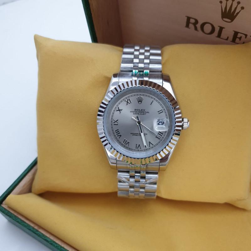 Rolex Datejust silver dial with Roman numerals and a distinctive fluted bezel