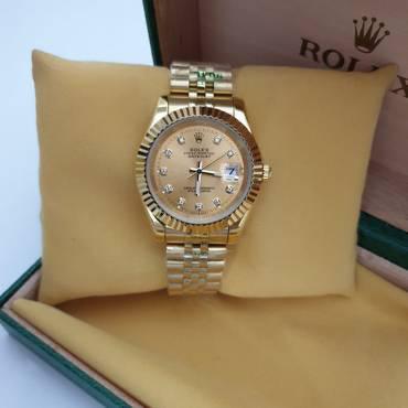 Rolex Datejust yellow gold champagne dial and diamond hour markers