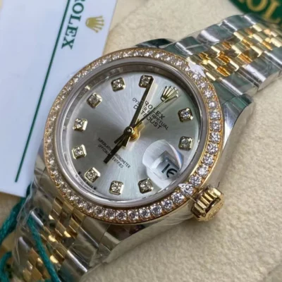 Rolex Datejust women's watch, featuring a grey dial, diamond markers, and a jubilee bracelet.